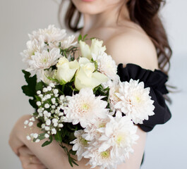 a woman holding a bouquet