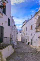 Typical narrow street in the historic center of Ostuni in Apulia, Italy.