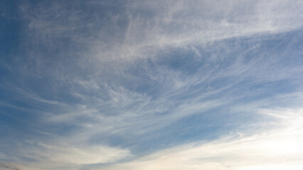 Fototapeta premium Beautiful blue sky over the sea with translucent, white, Cirrus clouds