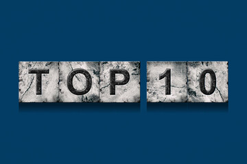 Top 10, words, isolated on a dark blue background. Alphabet on stone blocks.Rating. Rating concept.