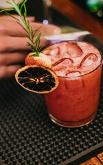 Strawberry hillbilly decorated with dried fruits on bar counter