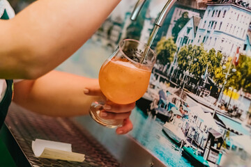 Craft beer being served in a special glass in Brazilian Pub