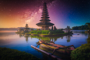 Pura Ulun Danu Bratan, Hindu temple with boat on Bratan lake landscape with milky way in Bali,...