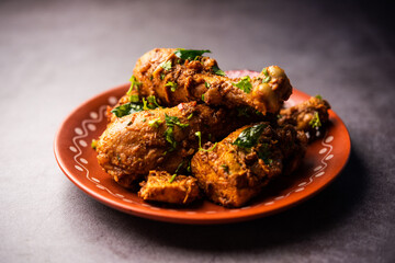 Sukha mutton or chicken, dry spicy Murgh or goat meat served in a plate or bowl