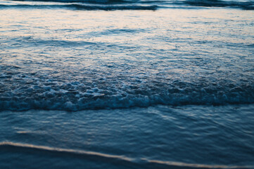 sunset on the beach with mountains