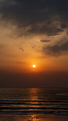 sunset on the beach with mountains