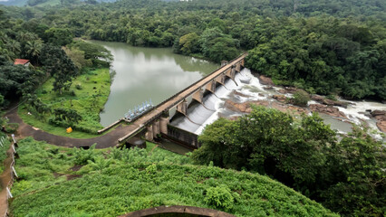 dam in the mountains , bridge and dam over the river from Kerala, India