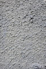 Pale grey rough wall with texture, grey background