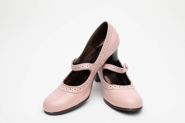 Studio photo of a pair of pink Mary Jane heels.