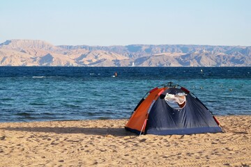 Single tent on beach by Red Sea around Aqaba, Jordan
