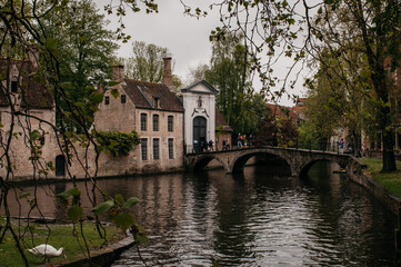 Fototapeta na wymiar Ancient canal and houses in European town Brugge