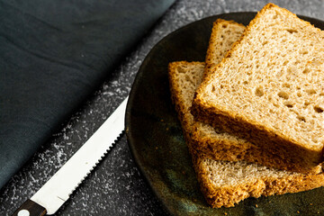 slices of loaf bread or whole bread with natural fermentation, in a breakfast scene or afternoon coffee break with butter