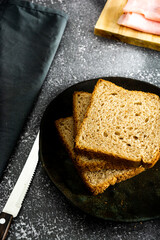 slices of loaf bread or whole bread with natural fermentation, in a breakfast scene or afternoon coffee break with butter