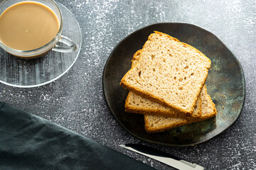 slices of loaf bread or whole bread with natural fermentation, in a breakfast scene or afternoon coffee break with butter