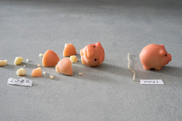 Happy New Year, leave the old year behind with crumbled and new marzipan pig