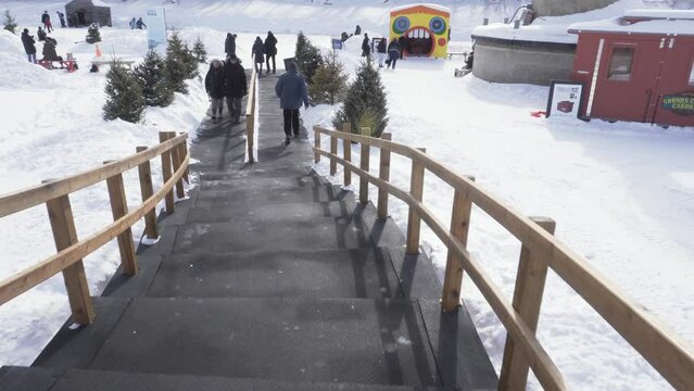 Winnipeg, Manitoba - Canada - February 27, 2022: Walking to the Frozen River to Open Air Ice Skating.