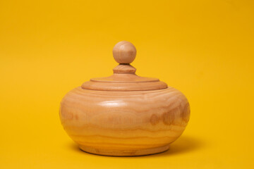 wooden sugar bowl on a yellow background