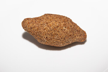 Traditional Syrian kibbeh isolated on white background in selective focus. Arabic kibe (quibe)