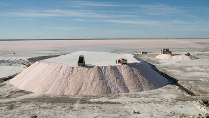 Trucks unloading raw salt bulk, Salinas Grandes de Hidalgo, La Pampa, Patagonia,  Argentina.