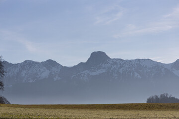 landscape with fog mountains in background