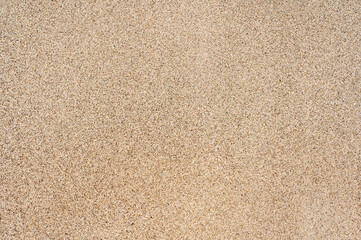 Fototapeta na wymiar Feinkörniger Sand eines Strandes als Sandtextur