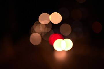 orange bokeh light circles on black background