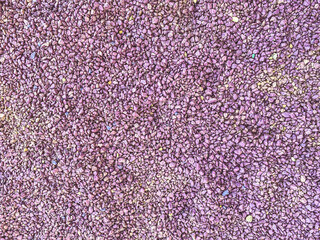 texture, background. 3d volumetric background, pink small stones for a decorative pavement of the road. small asphalt stones. sports ground cover