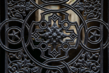 Fragment on an old door in the form of a woman's face close-up.