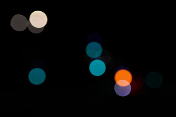 blue bokeh light circles on black background