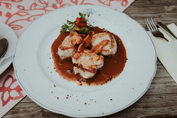 Food Traditional german dish. Port Filets with tasty gravy sauce