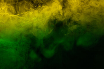 Obraz na płótnie Canvas Yellow steam on a black background.