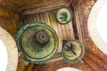 Fototapeta na wymiar Blizneva Old Believers Church's bell tower with three bells, Latvia.
