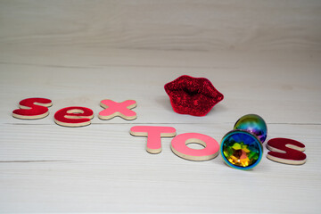sex toys phrase words from letters, concept of advertisement for sex shop or blog 