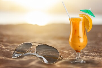 Fresh tropical cocktail on beach with sand. Summer sea vacation and travel concept. Exotic summer...