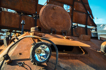 Close up of destroyed military equipment of the russian invaders. Rusty detail of a burnt combat vehicle. War in Ukraine