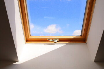  Minimalist window photo. View of a clear blue sky with clouds through a window in a sunny day. Minimalist interior photo.