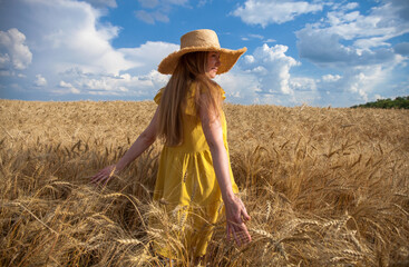 Red-haired woman in a yellow dress