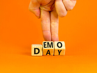 Demo day symbol. Concept words Demo day on wooden cubes. Businessman hand. Beautiful orange table...
