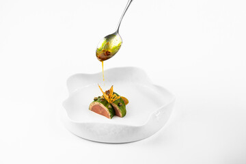 molecular cuisine  unusual white background concept. exquisite delicacies. beef with avocado