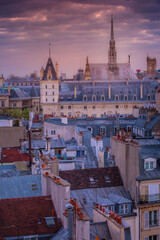 Fototapeta premium Saint Chapelle and quarter latin roofs at sunrise Paris, France
