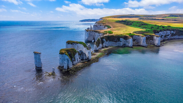 Old Harry Rocks are three chalk formations, including a stack and a stump, located at Handfast Point, on the Isle of Purbeck in Dorset, southern England. They mark the most eastern point of the Jurass