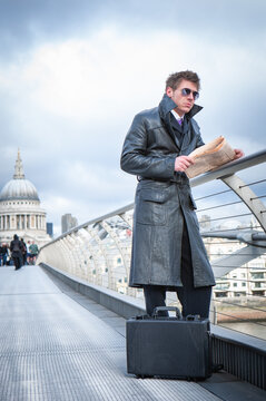 Undercover Agent; London Bridge. A spy waiting casually for his contact on Millennium Bridge, London; from a series of images with the same character.
