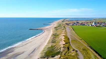 aerial view along the coast jutland denmark with a view toward the village Ferring and the Fjord...