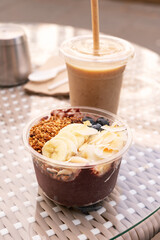 Acai Bowl with base made of wild acai berry, banana, medjoul dates, almond butter. Standard toppings: sliced banana, fresh blueberries, coconut chips and homemade gluten free buckwheat granola