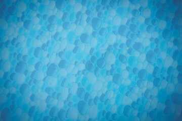 Fototapeta na wymiar swimming pool background texture under blue water, Texture of water surface and bubbles bottom. Overhead view. Summer background. Copy space