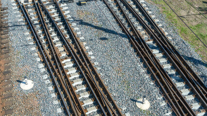 Top perspective view on many railway track lines. Railway, railroad track. Cargo and journey concepts.