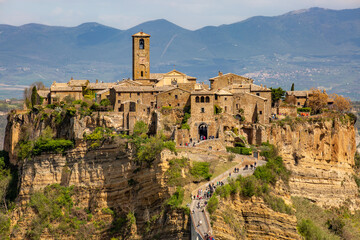 Close up panoramic aerial view of Civita di Bagnoregio with a view of the Calanchi Valley, Lazio, Bagnoregio, province of Viterbo.The most beautiful villages in Italy.The dying city - obrazy, fototapety, plakaty