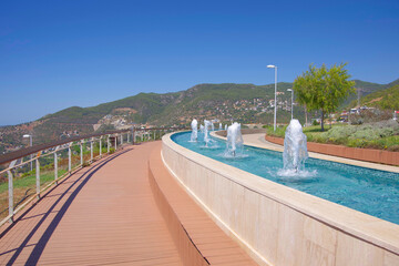 Fototapeta premium An observation deck with fountains on a mountain above the city of Alanya in Turkey.