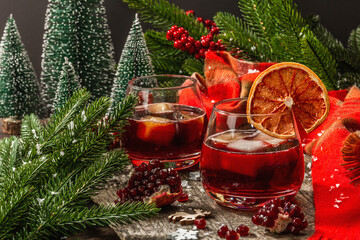 Non-alcoholic cocktail with fruits syrup and ice. Christmas traditional decor, New Year arrangement