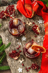 Non-alcoholic cocktail with fruits syrup and ice. Christmas traditional decor, New Year arrangement